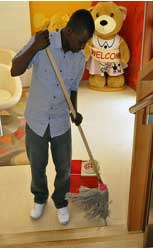 Man cleaning up to prevent ants from coming in the house